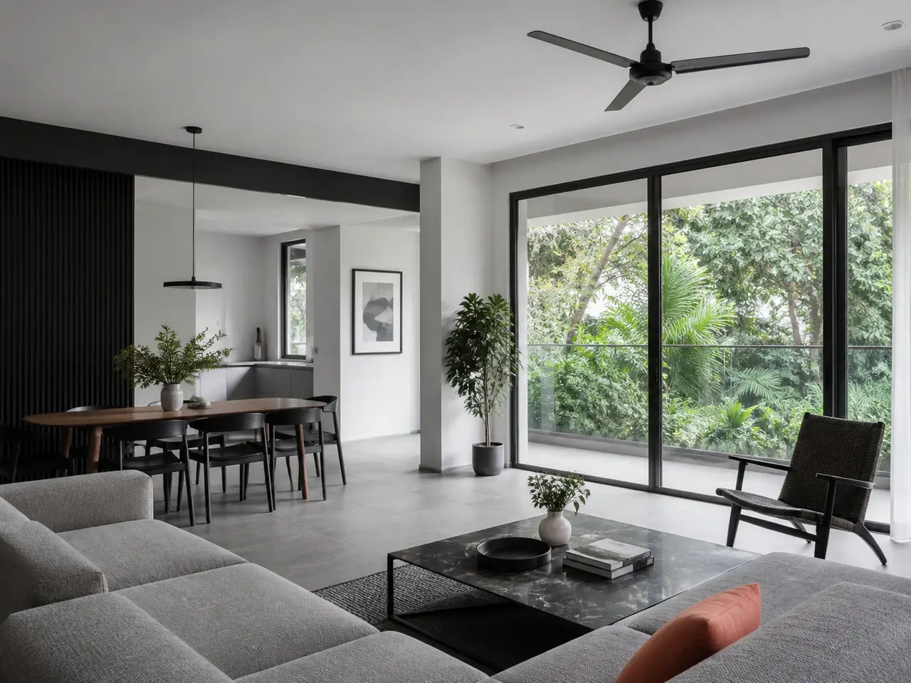Neutral contemporary apartment living and dining room opening to greenery